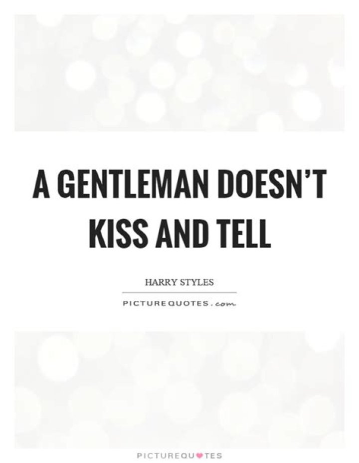 A gentleman doesn't kiss and ___