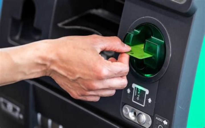 Cash dispenser in a bank lobby: Abbr.