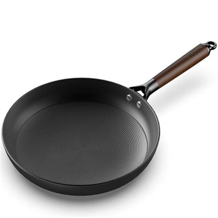 Cast-___ skillet (weighty pan)