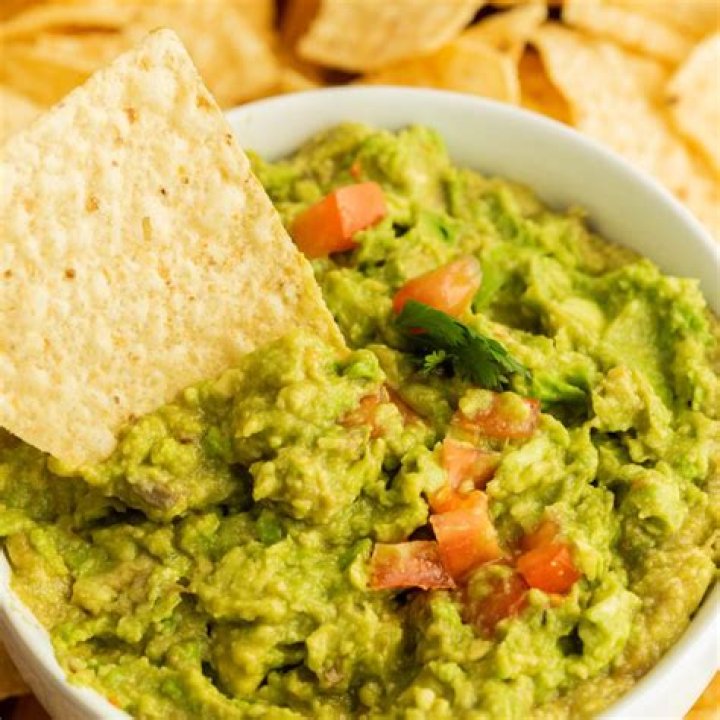 Chip whose toppings may include guacamole