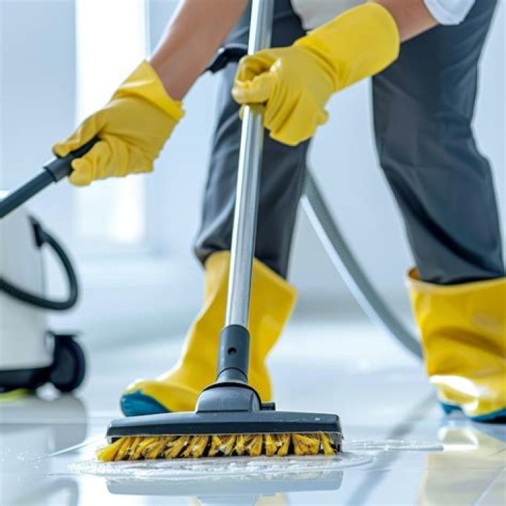 Clean the floor with a broom
