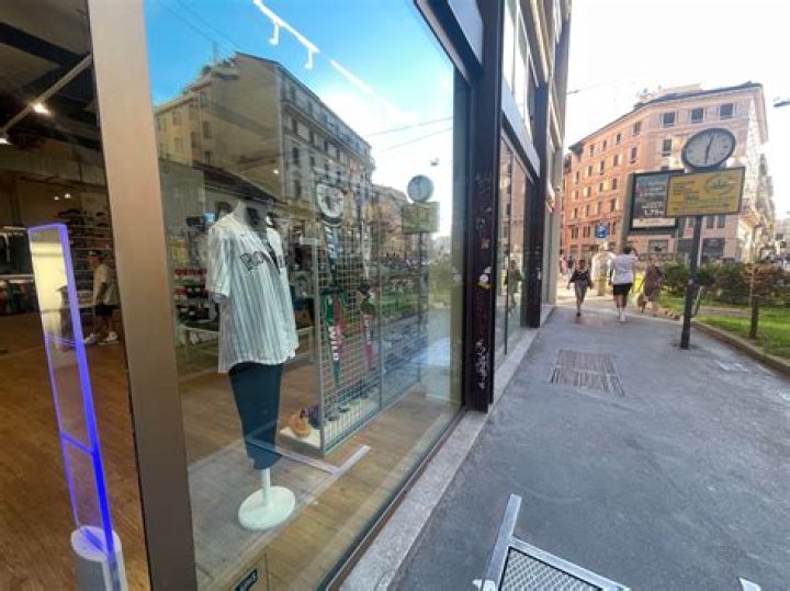 OPEN 9 ___ 5 (sign in a store window)