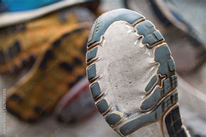 Piece of rubber or metal on the sole of an athlete's shoe