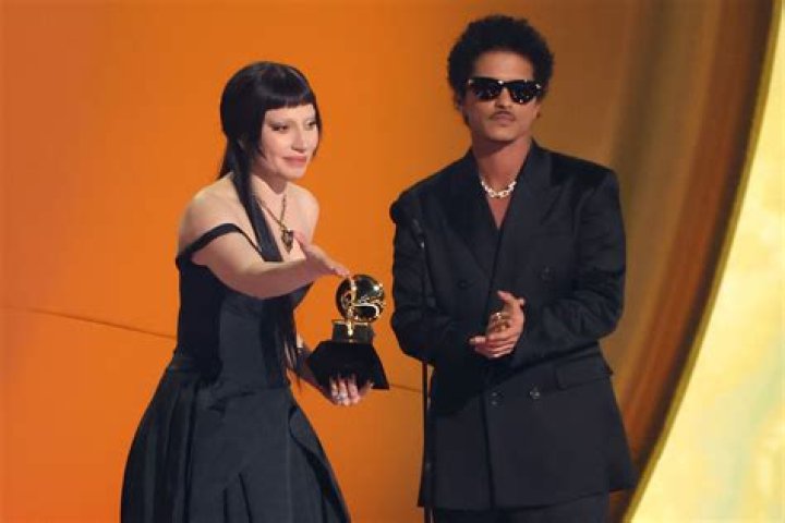 Pop star who sang a duet with Lady Gaga on his hit Your Song at the 2010 Grammys: 2 wds.