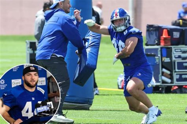 Prepares to throw as a dart