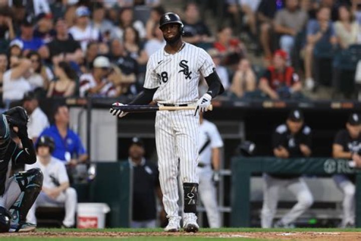 Shoeless White Sox outfielder whose surname is Mississippi's capital: 2 wds.