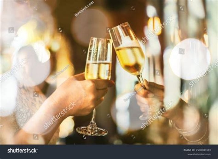 Short speech followed by people clinking champagne glasses