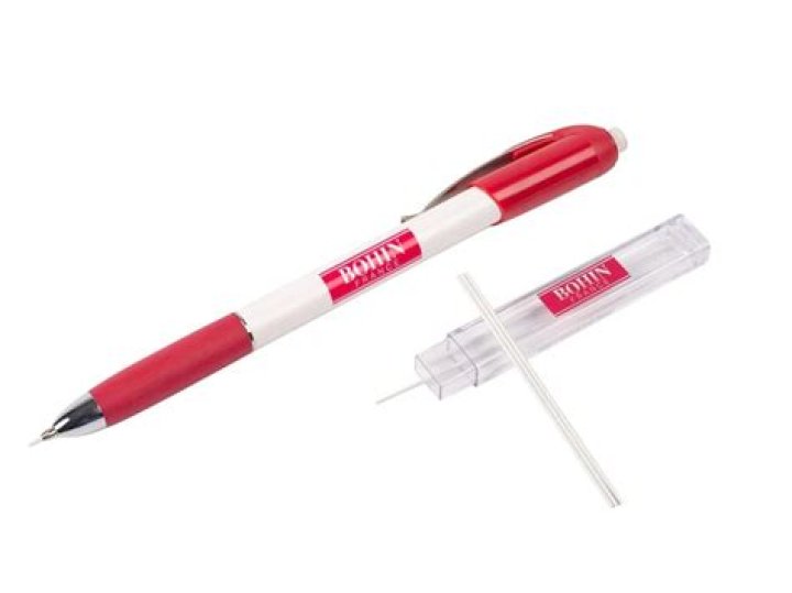 Small mark from a pencil point