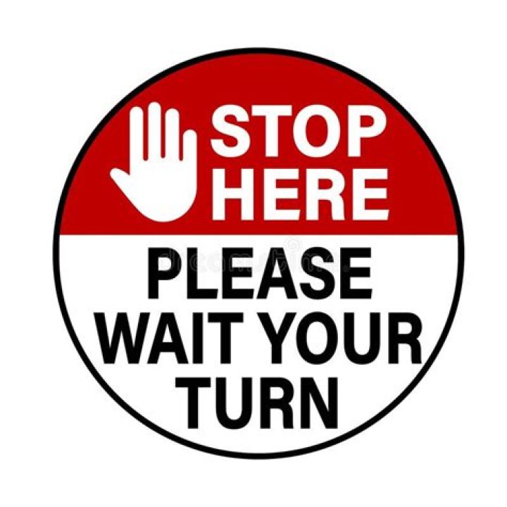 Stand in ___ (wait your turn)