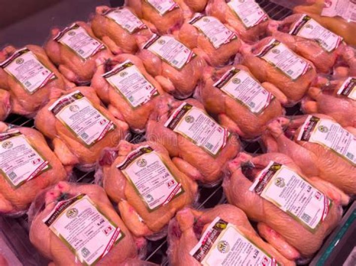 Supermarket section with whole chickens
