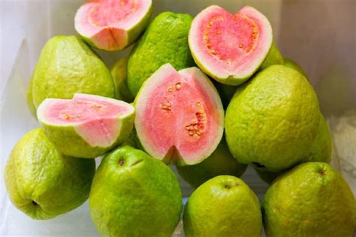 Tropical fruit that's green outside and pink inside