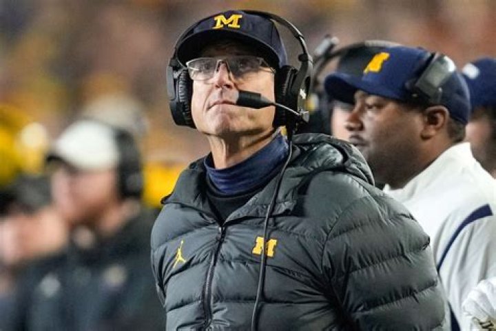 University of Michigan football coach who's the highest paid public employee in Michigan: 2 wds.