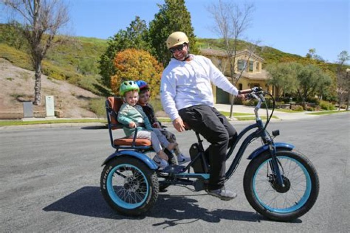 Wheeled motorcycle attachment with a seat for a passenger